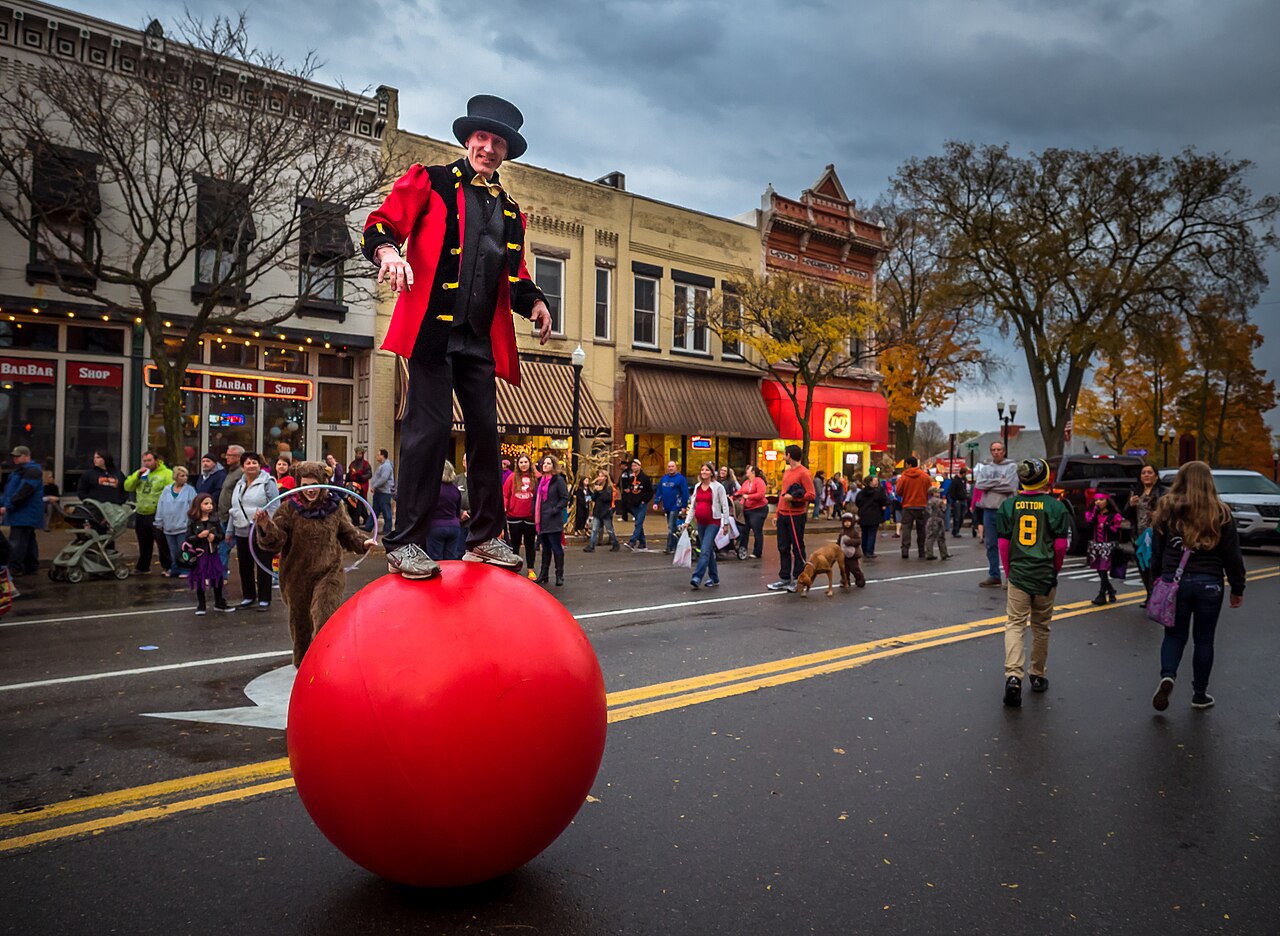 A performer balances on a red ball during Legend of Sleepy Howell in October 2015