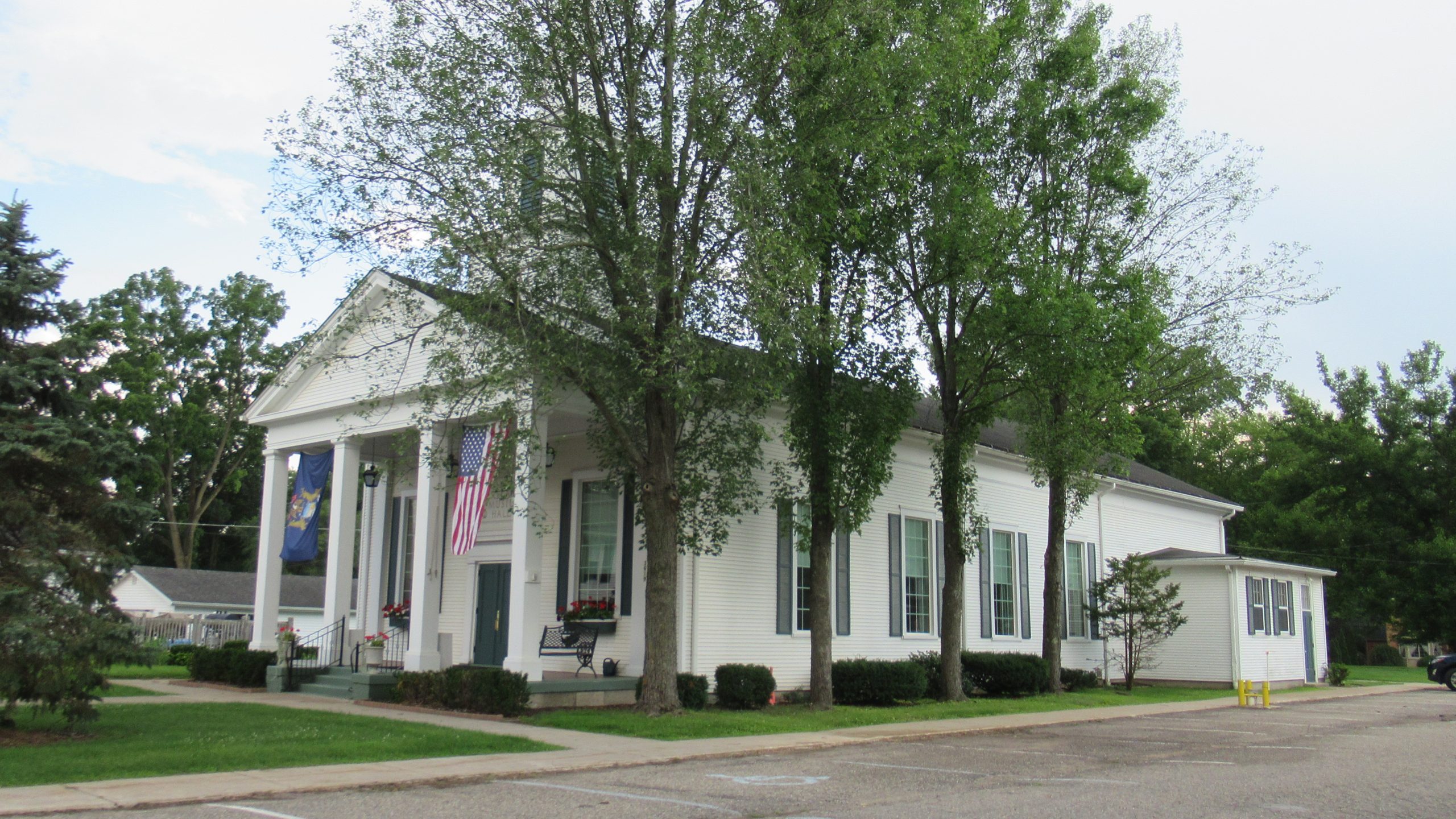 Historic white Hartland Music Hall building viewed from Avon Street