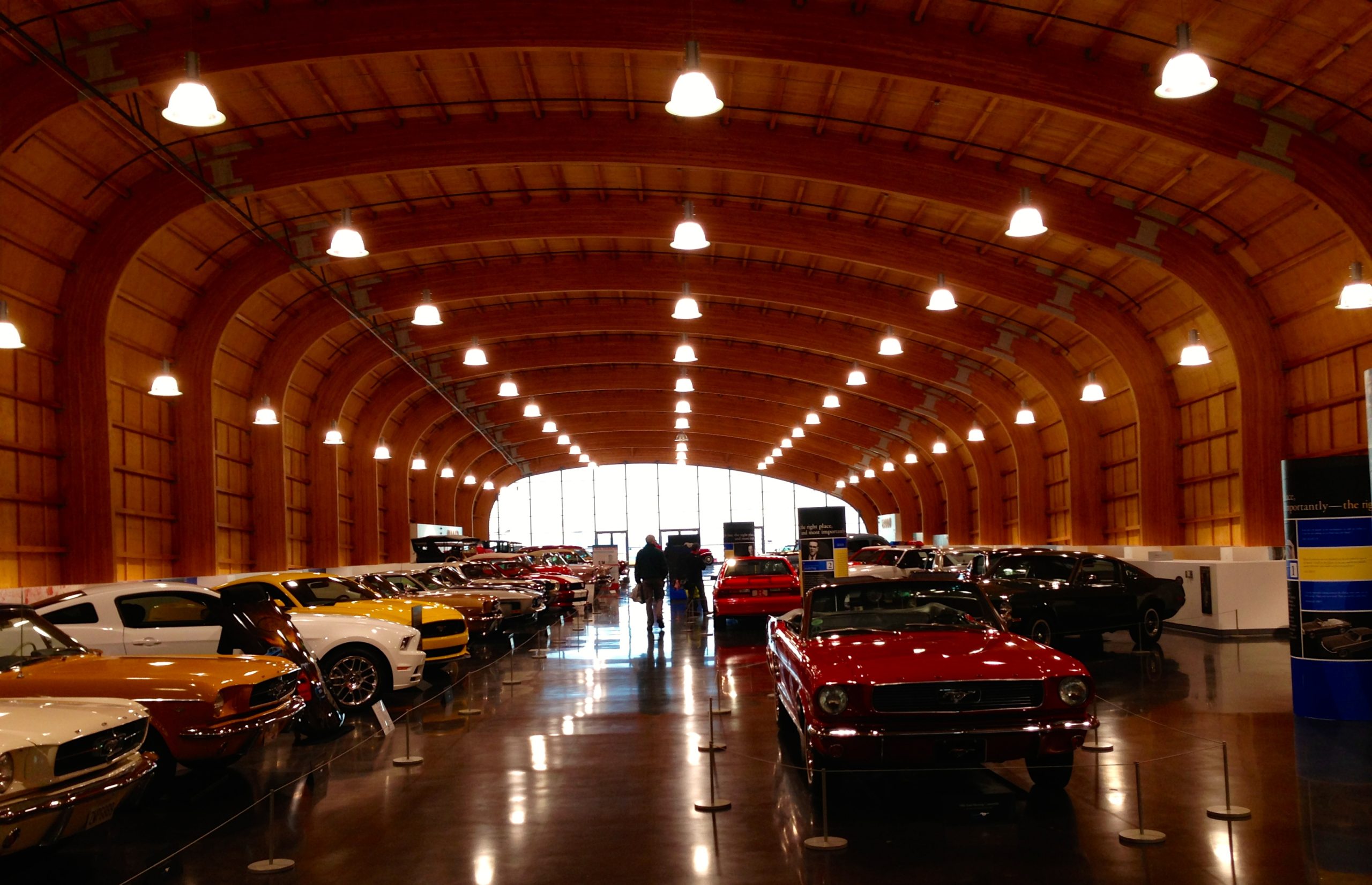 Rows of classic cars displayed inside an automobile museum