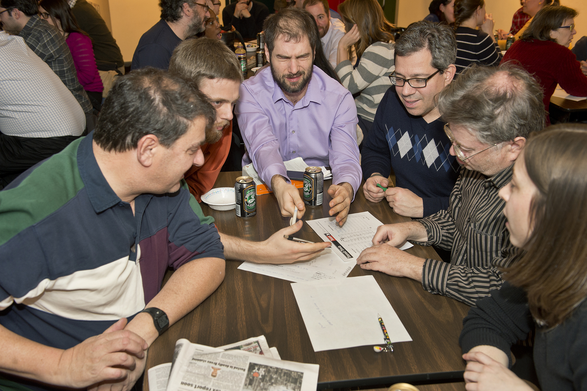 People seated at tables during a public trivia night