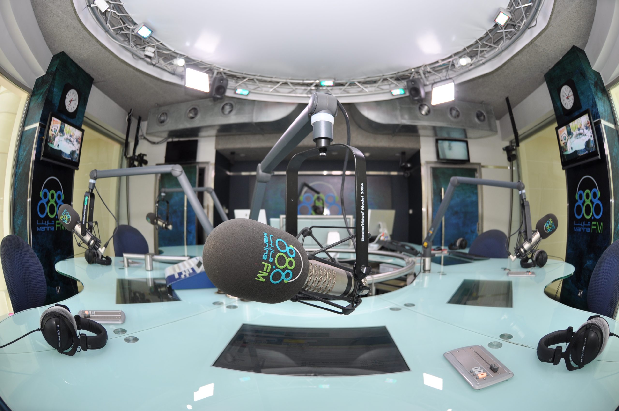 Microphones, headphones and controls inside a radio studio